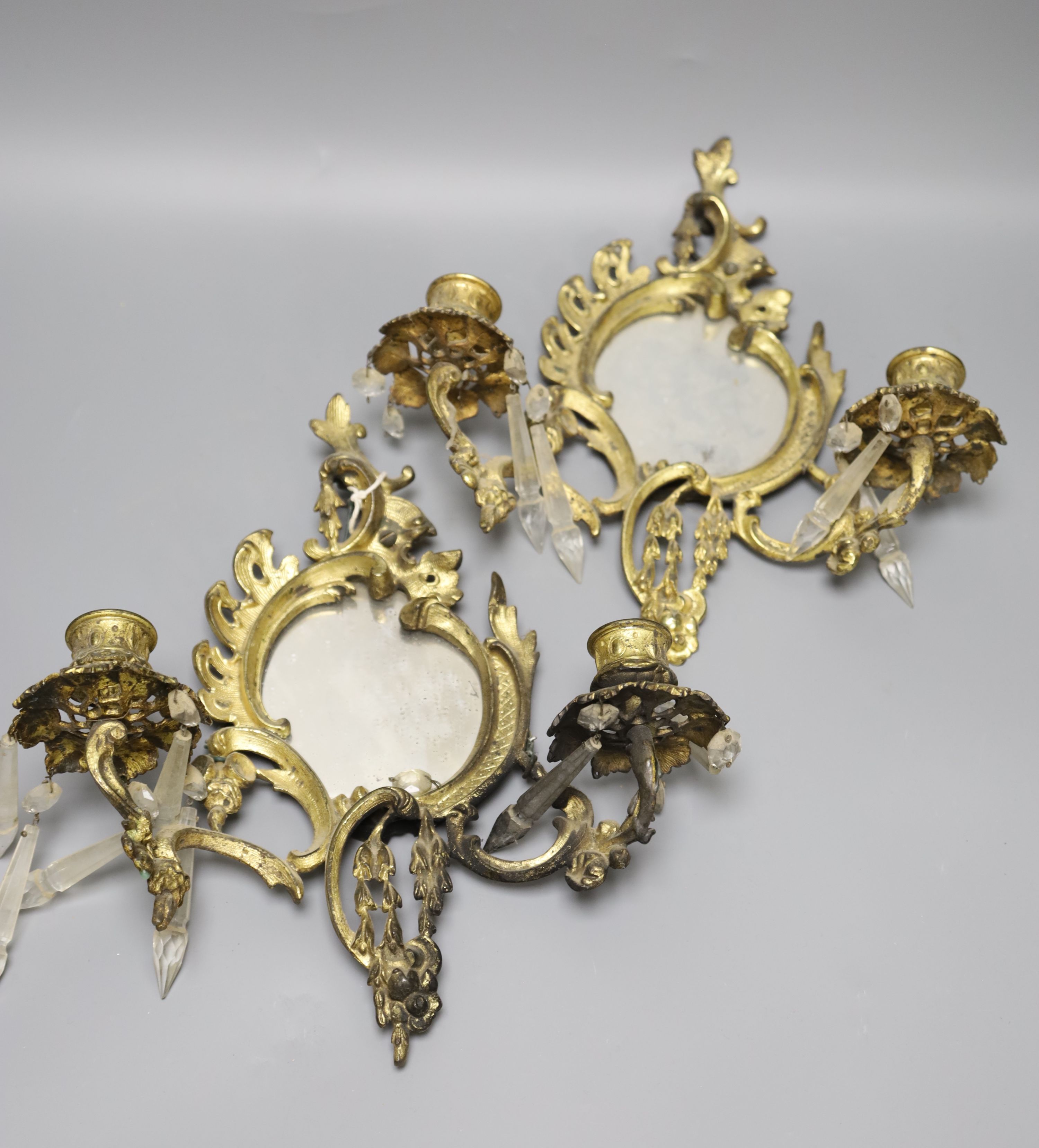 A pair of ormolu girandoles with lustres (a.f.)